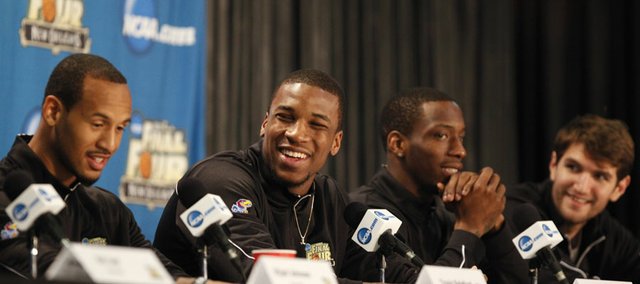 Kansas forward Thomas Robinson, second from left, smiles as he and teammates Travis Releford, left, Tyshawn Taylor and Jeff Withey respond to questions during a press conference on Sunday, April 1, 2012 at the Superdome.