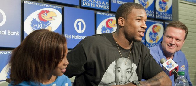 Kansas junior basketball player Thomas Robinson, declares for the NBA Draft on Monday during a press conference with KU coach Bill Self and Robinson's sister Jayla, left.