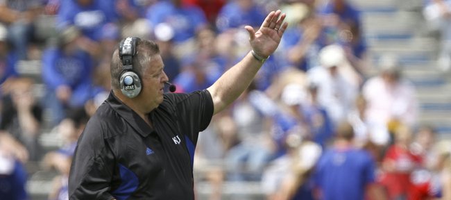 Kansas head coach Charlie Weis calls a play during the first half of the Spring Game on Saturday, April 28, 2012 at Kivisto Field.