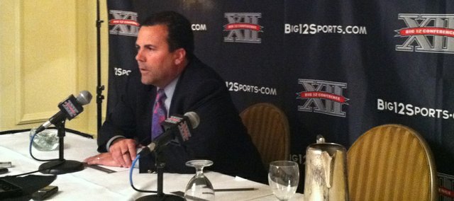 Kansas University athletic director Sheahon Zenger speaks to reporters about interim Big 12 commissioner Chuck Neinas and incoming commish Bob Bowlsby at the league’s spring meetings on Thursday, May 31, 2012, in Kansas City, Mo.