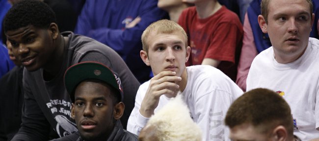 Kansas commit Conner Frankamp, center, watches from behind the bench prior to tipoff against Missouri on Feb. 25, 2012, at Allen Fieldhouse.