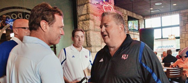 Kansas men's basketball coach Bill Self and KU football coach Charlie Weis get together for a radio talk show Monday, July 30, 2012, at the Oread Hotel.