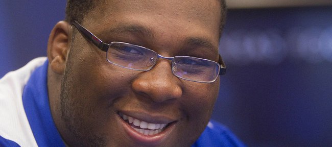 Kansas offensive tackle Aslam Sterling smiles during an interview Wednesday at the Anderson Family Football Complex at KU.