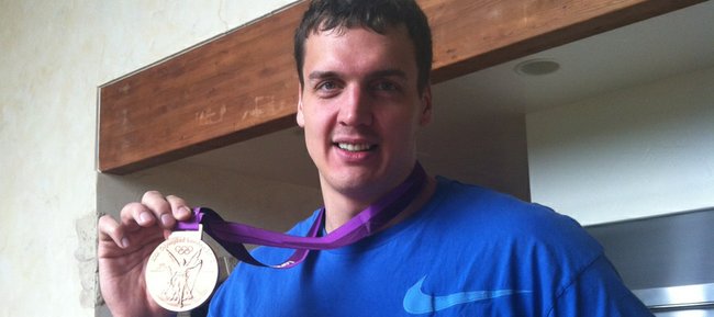 Former Kansas University center Sasha Kaun displays the bronze medal he won with the Russian national team this summer at the 2012 Olympic Games in London. Kaun was the first Jayhawk men’s basketball player since Danny Manning to win a medal at the Olympics.