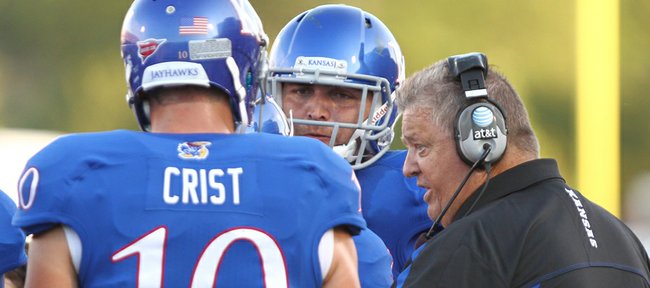 Kansas head coach Charlie Weis has a talk with quarterback Dayne Crist and tight end Mike Ragone in the second quarter, Saturday, September 1, 2012 at Memorial Stadium.