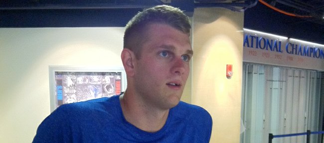 Former Kansas University center Cole Aldrich speaks with reporters during a one-day visit Wednesday, Sept. 5, 2012, to Allen Fieldhouse.