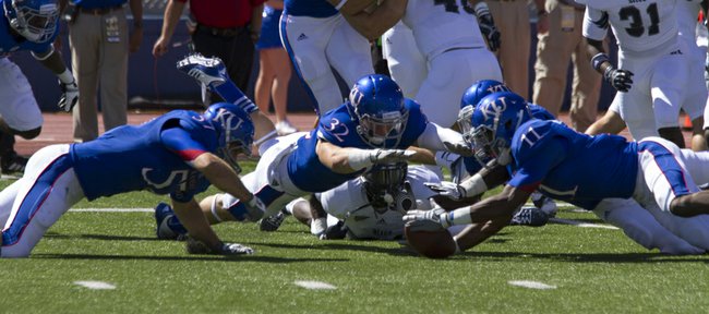 John Young/Journal-World Photo
Kansas players scramble to recover a fumble during their game against Rice Saturday, Sept. 8, 2012 at Memorial Stadium. 
