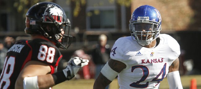 Kansas University safety Bradley McDougald (24) matches up with Northern Illinois tight end Tim Semisch in the first half of KU's game against the Huskies, Saturday, Sept. 22, 2012, in DeKalb, Ill.
