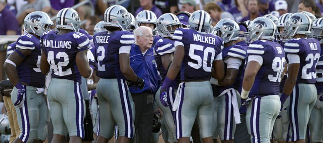 In this Sept. 1, 2012, file photo, Kansas State coach Bill Snyder, center, talks to his team during a timeout in a game against Missouri State in Manhattan.