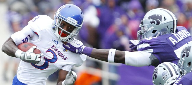 Kansas running back Tony Pierson is yanked down by the collar by Kansas State defensive end Adam Davis during the first quarter on Saturday, Oct. 6, 2012 at Bill Snyder Family Stadium in Manhattan.