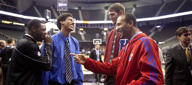 The four Kansas seniors from left, Elijah Johnson, Kevin Young, Jeff Withey and Travis Releford joke around before taking their places at the interview table during Big 12 Media Day on Wednesday, Oct. 17, 2012 at the Sprint Center in Kansas City, Mo. Coaches and players representing each school in the conference were available for interviews. 