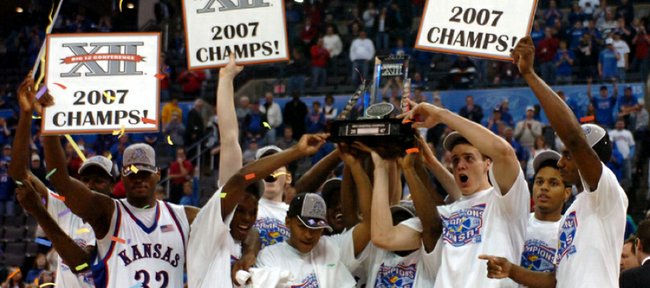 The 2006-2007 Kansas University men’s basketball team hoists the Big 12 Tournament Championship trophy after an 88-84 victory over Texas on March 11, 2007.