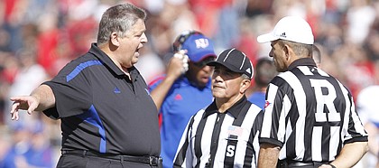 Kansas head coach Charlie Weis argues with game officials over a call on a Kansas punt during the second quarter on Saturday, Nov. 10, 2012 at Jones AT&T Stadium in Lubbock, Texas.
