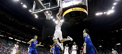 Kansas center Jeff Withey soars in for an alley-oop dunk against Saint Louis in the first half of the championship game of the CBE Classic, Tuesday, Nov. 20, 2012 at the Sprint Center in Kansas City, Missouri.