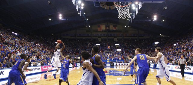 Kansas guard Elijah Johnson pulls up for a bucket over San Jose State guard James Kinney to end the Jayhawks' field goal drought during the second half on Monday, Nov. 26, 2012 at Allen Fieldhouse.
