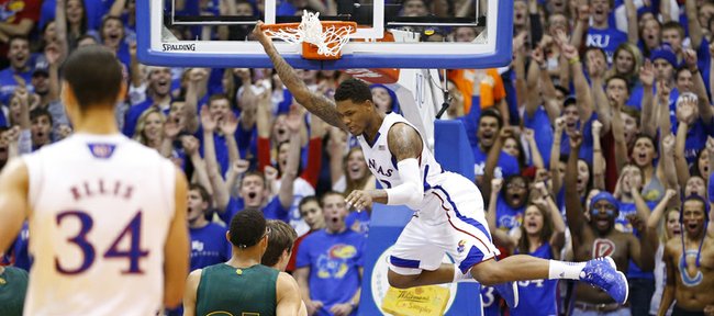 Kansas guard Ben McLemore swings off the rim after a dunk against Baylor during the second half on Monday, Jan. 14, 2013 at Allen Fieldhouse.