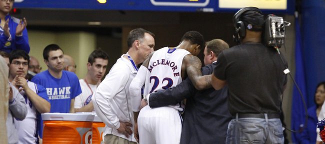 Fans watch as Kansas guard Ben McLemore is helped into the lockerroom late in the second half on Monday, Jan. 14, 2013 at Allen Fieldhouse.