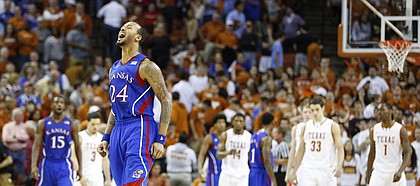 Kansas guard Travis Releford celebrates as time expires in the Jayhawks' 64-59 comeback win against Texas on Saturday, Jan. 19, 2013 at Frank Erwin Center in Austin, Texas.