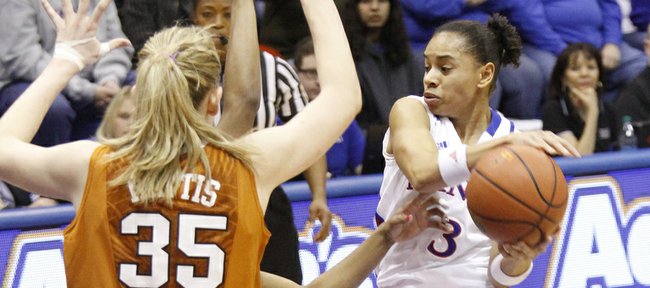 Angel Goodrich (3) drives into the lane before passing during the Jayhawks 76-38 win against the Texas Longhorns Wed, Jan. 23, 2013, at Allen Fieldhouse. Goodrich scored 20 points and passed the 1,000 point mark in her Jayhawk career.