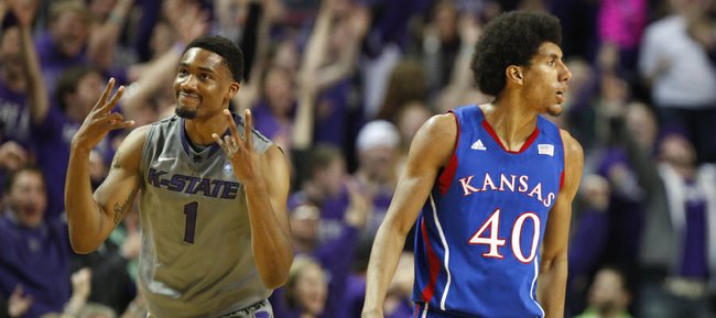 Kansas State guard Shane Southwell signals "three" after hitting one over Kansas forward Kevin Young during the first half on Tuesday, Jan. 22, 2013 at Bramlage Coliseum.