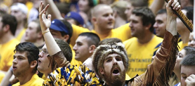 The West Virginia Mountaineer mascot, Jonathan Kimble, cheers during the first half West Virginia’s game with Kansas State on Jan. 12, 2013, in Morgantown, W.Va.