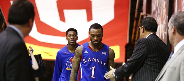 Kansas guard Naadir Tharpe hangs his head as he and Andrew White make their way to the lockerroom after the Jayhawks' 72-66 loss to Oklahoma on Saturday, Feb. 9, 2013 at Noble Center in Norman, Oklahoma. The loss is the Jayhawks' third-straight.