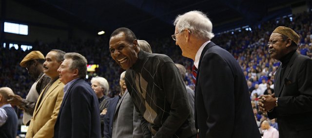 Kansas great Jo Jo White laughs with former Jayhawks coach Ted Owens during a halftime ceremony recognizing 115 years of basketball at KU, Saturday, Feb. 23, 2013 at Allen Fieldhouse.