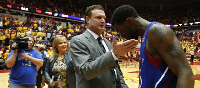 Kansas head coach Bill Self gives a congratulatory pat to Elijah Johnson after the Jayhawks' 108-96 overtime win over Iowa State on Monday, Feb. 25, 2013 at Hilton Coliseum in Ames, Iowa.