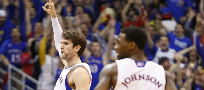 Kansas center Jeff Withey signals "three" after hitting one against Texas Tech during the first half, Monday, March 4, 2013 at Allen Fieldhouse.