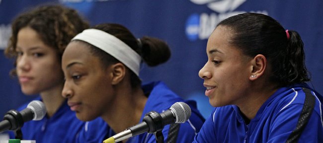 Kansas' Angel Goodrich, right, takes questions alongside Monica Engelman, left, and Carolyn Davis during a news conference one day before a second-round game against South Carolina in the NCAA women's college basketball tournament, Sunday, March 24, 2013, in Boulder, Colo. 
