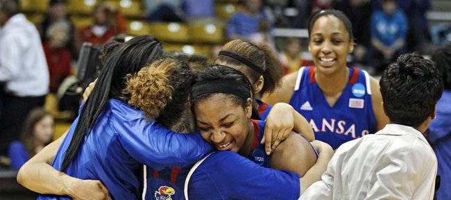 Kansas players celebrate after defeating South Carolina 75-69 in a second-round game in the women's NCAA college basketball tournament, Monday, March 25, 2013, in Boulder, Colo.