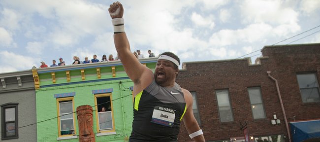 Reese Hoffa celebrates his last and longest throw of the Kansas Relays Men's Elite shot put event on Wednesday, April 18, 2012, in downtown Lawrence. 