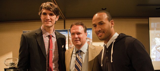 Jeff Withey, left, and Travis Releford flank Kansas basketball coach Bill Self as they were named co-winners of the Danny Manning Award at the annual KU basketball banquet Monday, April 15,2013, at the Holiday Inn.