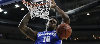 Memphis forward Tarik Black dunks against Michigan State forward Adreian Payne (5) in the second half of a third-round game of the NCAA college basketball tournament Saturday, March 23, 2013, in Auburn Hills, Mich.