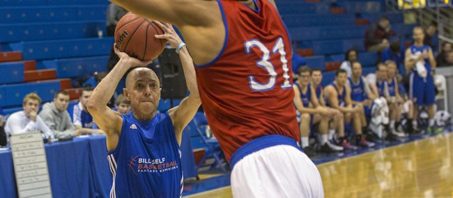 Former Kansas player Wayne Simien towers over Richard Rosenzweig, New York City, as he goes for a block during a game at the Bill Self Fantasy Camp on Thursday, May 2, 2013, at Allen Fieldhouse. 