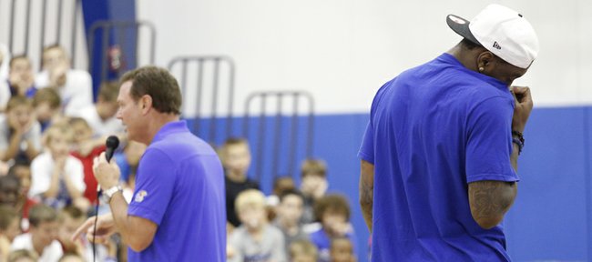 Kansas forward Jamari Traylor turns to wipe away a tear as head coach Bill Self tells a group of young basketball campers the story of Traylor's upbringing which included bouts of homelessness during Self's basketball camp, Monday, June 10, 2013 at the Horejsi Center. Traylor was the guest speaker for the day and took questions from the campers. Nick Krug/Journal-World Photo