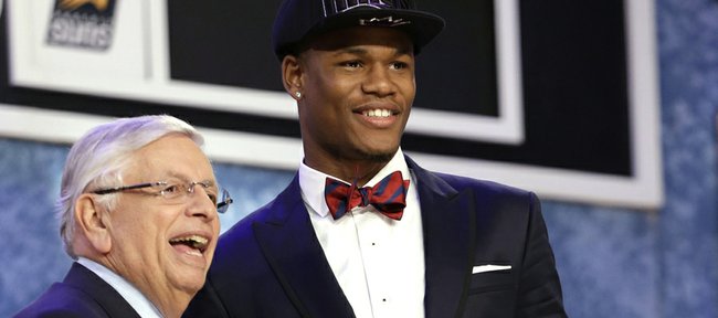 NBA Commissioner David Stern, left, shakes hands with Kansas' Ben McLemore, who was selected by the Sacramento Kings in the first round of the NBA basketball draft, Thursday, June 27, 2013, in New York.