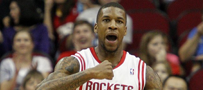Houston Rockets power forward Thomas Robinson (41) pumps his fist after scoring against the Cleveland Cavaliers during the first half of an NBA basketball game, Friday, March 22, 2013, in Houston.
