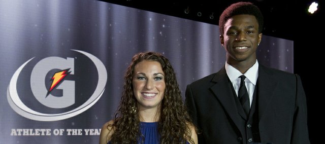 In a photo provided by Gatorade, Andrew Wiggins, right, and Morgan Andrews hold their trophies after being named the nation's top prep male and female athletes, Tuesday, July 16, 2013, in Los Angeles.