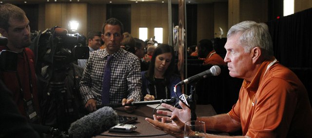 Texas coach Mack Brown talks to members of the media during a breakout session at the Big 12 Conference football media days on Tuesday, July 23, 2013, in Dallas.