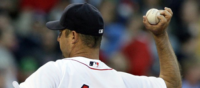 Former Boston Red Sox pitcher Tim Wakefield winds up a knuckleball in this file photo from June 16, 2009. Knuckleball pitchers like Wakefield are rarities at the youth, college and pro levels because of the pitch’s difficult, unpredictable nature.