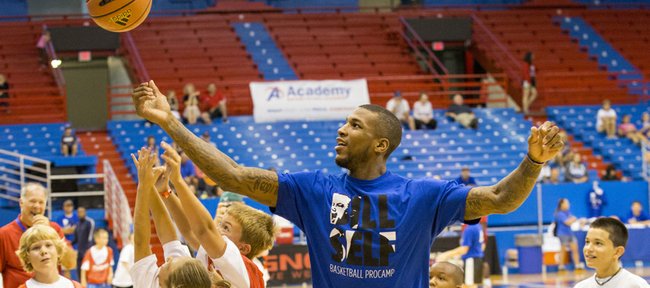 Former Kansas University forward Thomas Robinson, a current member of the NBA’s Portland Trail Blazers, goes after a rebound during the Bill Self basketball camp held Sunday, Aug. 18, 2013, at Allen Fieldhouse.