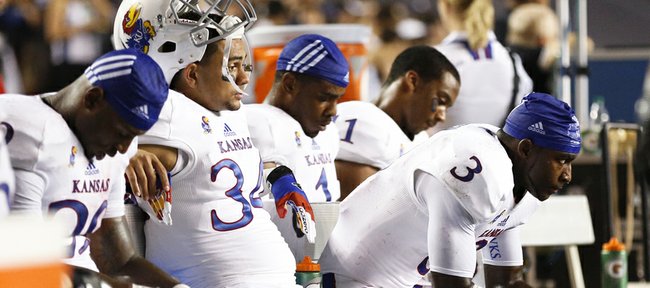 Kansas running back Tony Pierson (3) stews on the bench with some of the other running backs and receivers after a deep pass to him was ruled incomplete late in the fourth quarter against Rice on Saturday, Sept. 14, 2013 at Rice Stadium in Houston, Texas.