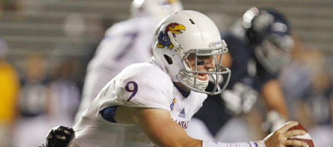 Kansas quarterback Jake Heaps is sacked on the final possession by Rice defensive tackle Christian Covington on Saturday, Sept. 14, 2013 at Rice Stadium in Houston, Texas.