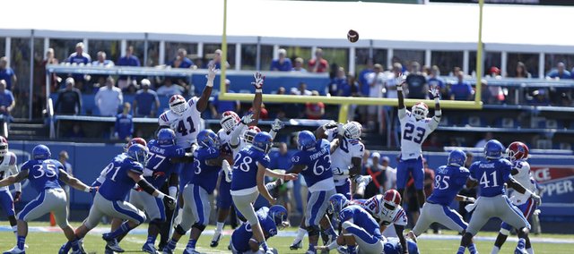 Kansas kicker Matthew Wyman watches his 52-yard field goal sail toward the uprights for a 13-10 win over Louisiana Tech during the on Saturday, Sept. 21, 2013 at Memorial Stadium.