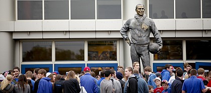 The F.C. "Phog" Allen statue looms over fans waiting to enter the fieldhouse for Late Night in the Phog on Friday, Oct. 12, 2012 at Allen Fieldhouse.