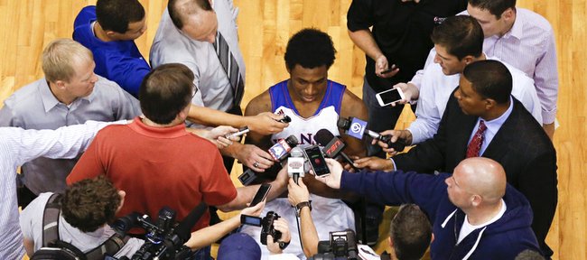 Media members crowd around the highly-touted Kansas freshman, Andrew Wiggins during Media Day on Wednesday, Sept. 25, 2013 at Allen Fieldhouse. Nick Krug/Journal-World Photo