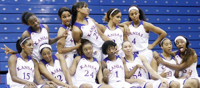 The Kansas women's basketball team makes a funny pose during team photographs during the KU women's basketball team media day Wednesday at Allen Field House.
