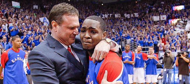 Kansas senior point guard Sherron Collins gets an emotional hug from head coach Bill Self as he is honored by the Allen Fieldhouse crowd before tipping off against Kansas State, Wednesday, March 3, 2010.