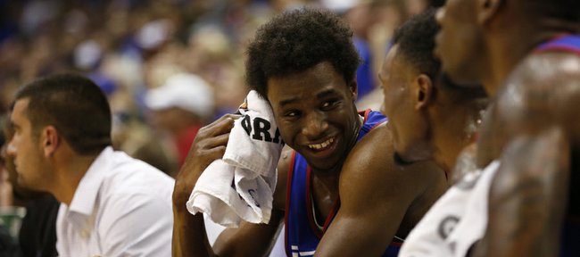 Kansas forward Andrew Wiggins laughs with his teammates on the bench during the Jayhawks' Late Night scrimmage, Friday, Oct. 4, 2013 at Allen Fieldhouse.